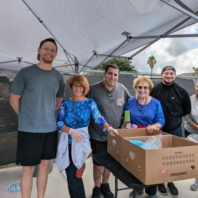 Mary's Kitchen Pantry volunteers featuring Gloria Suess in blue on the right