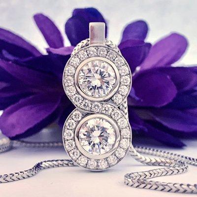 We make one-of-kind pieces for special occasions. This exquisite pendant contains four carats of diamonds.