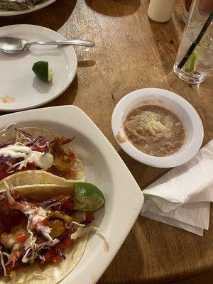 Breaded shrimp tacos and side of beans