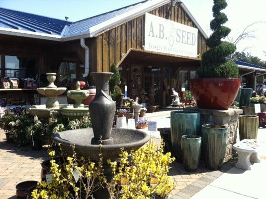 Lots of colorful glazed pots, bird baths and statuary.