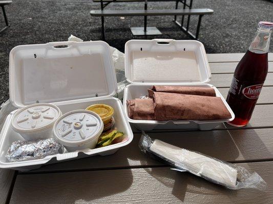 The Messy Sampler is like Christmas morning, opening the 4 meats served in traditional red butcher paper. (Along with 2 sides.)