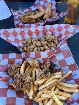 On top, fried catfish basket, middle fried crawfish tail appetizer and bottom fried oyster basket.