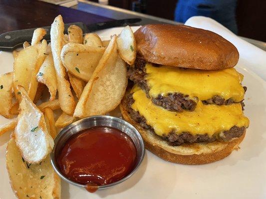 Double burger with fried onion. Raw onion, tomato, lettuce on side with house made fries!