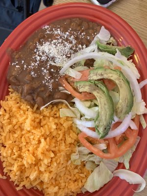 Rice and beans as a side. The avocado is a little over ripe.