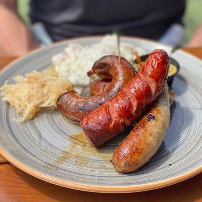 Sausage Sampler (bratwurst, keilbasa, wurzigwurst, potato salad, sauerkraut) spicy mustard