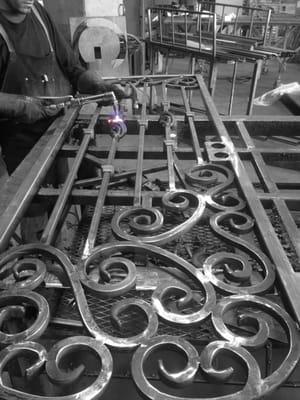 Custom hand forged solid bar scroll fabrication. www.arironllc.com