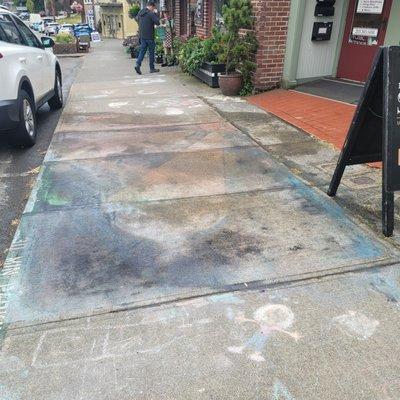 This store owner threw buckets of water and had to scrub it off with a brush.