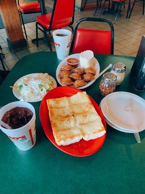 Garlic cheese bread, side salad, fried ravioli, and two fountain drinks