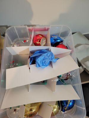 Here is how I found my Christmas ornaments all broken and a latex glove thrown in the box