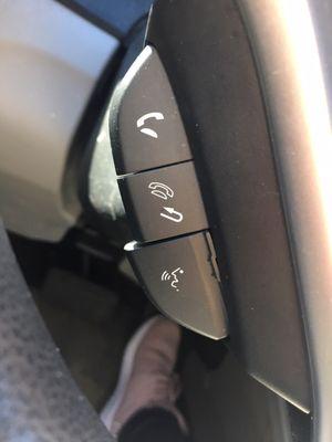 The push to talk button is literally OUTSIDE OF THE STEERING WHEEL