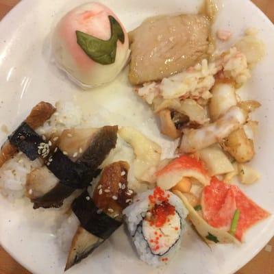 Plate 1 - unagi sushi (worst I've had), sushi roll, some crab dish (good!), fried calamari, baked white fish, and peach bun.