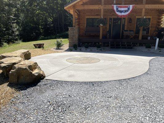 Natural boulder seats, broom finished concrete patio with PA Flagstone decorative inlay in Port Matilda, PA