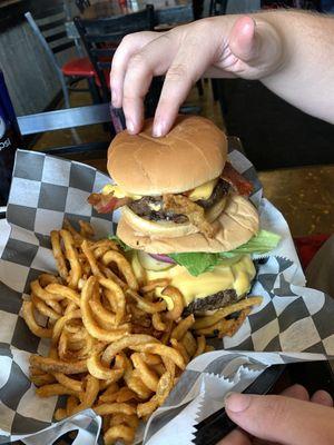 My half pound western burger compared to my fiancé's whole pound burger.