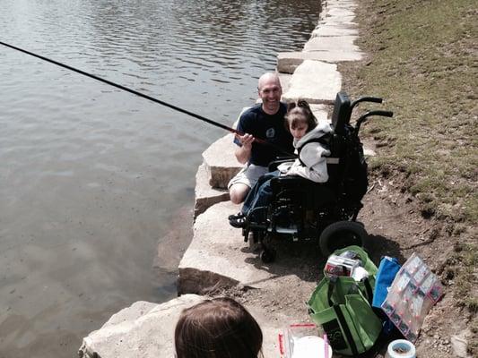 Evie getting pole fishing class in Downers Grove.