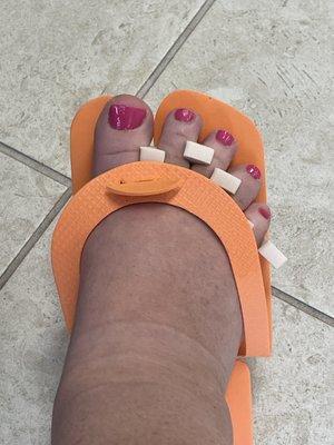 Pedicure complete with pink toes for the summer.