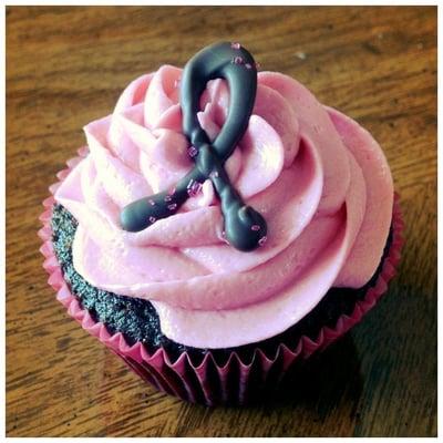 Chocolate raspberry cake with raspberry vanilla frosting for a bake sale fundraiser for breast cancer