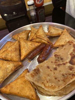 Samosa's, chapati, and Kenyan sausages.