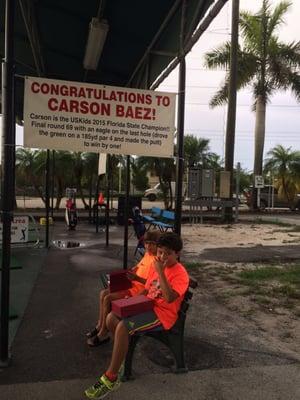 Thank you Coach Scott Jones!! Carson couldn't stop giggling (sitting here with Cameron waiting to show Coach their trophies)!