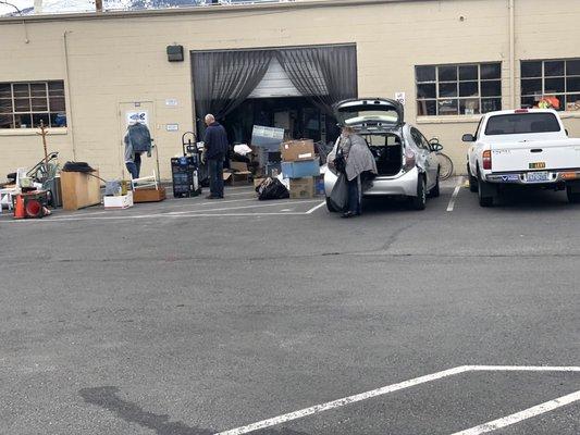 Tuesday, March 19, 2019: people unloading donations.