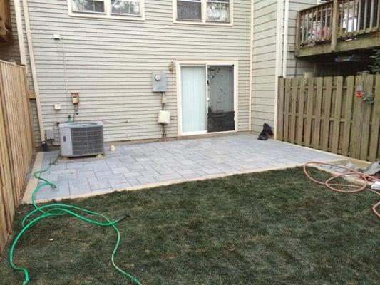 This back yard of a townhome was wanting to make the yard seem bigger than the eye could tell so a Techo Bloc paver system wa...