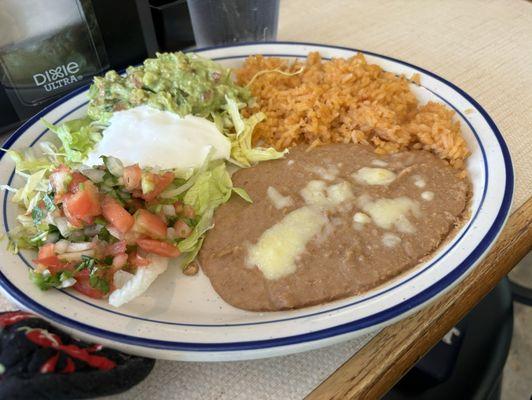 Fajita accompaniments! Refried beans and guacamole were very good!