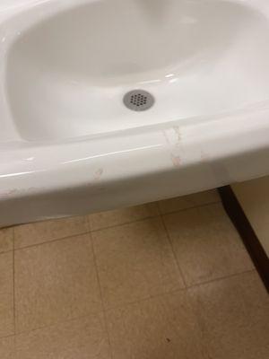 Blood all over the bathroom sink.