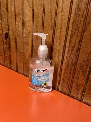 Hand sanitizer on every table