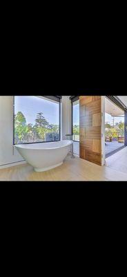 Free standing bathtub bathroom remodeled by Goldenline Remodeling