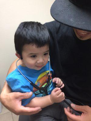 My son was so happy after Dr. Arasheben let him use his stethoscope. Good job doctor!