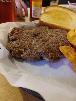 This is a hamburger steak. It can come with onions and peppers. My husband likes it plain. Look at the size of that hamburger steak y'all.