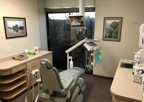 You can watch TV while in the treatment room chair. No more counting dots on the ceiling!