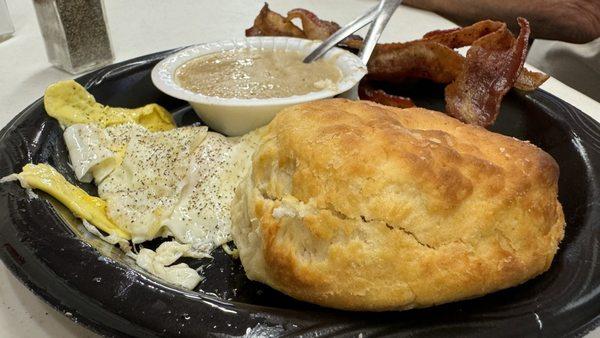 Regular biscuit and gravy, two eggs and order of bacon.