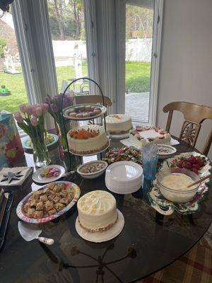 Dessert of lemon cake on the far upper right with strawberries on top.