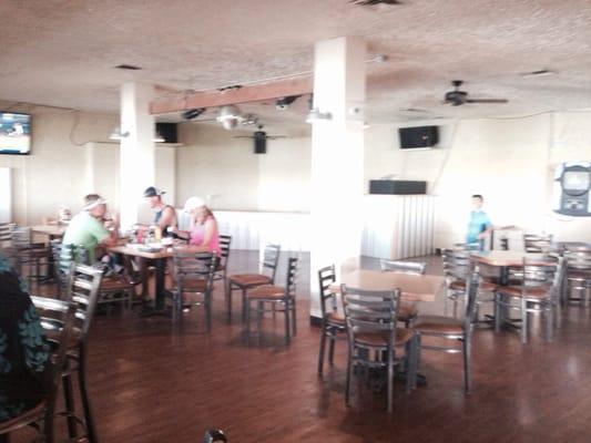 Bar Area with Stools, Tables, Jute-Box, ATM & Band Stage.