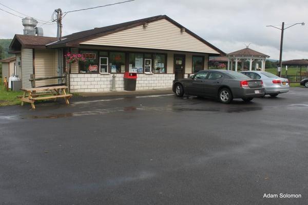 Exterior of store showing some of ample parking.