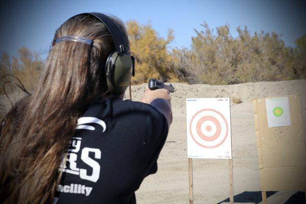 Lisa showing us how to shoot.