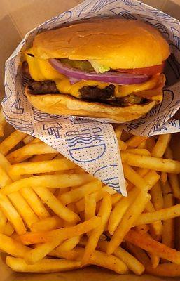 Single smashed burger with seasoned fries.