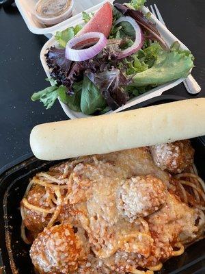 Spaghetti and meatballs for lunch with a small salad and breadstick