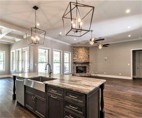 Open concept kitchen; Cafe Latte granite kitchen island with a leathered finish