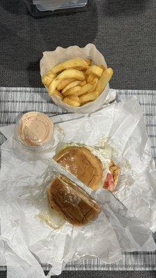 Grilled chicken sandwich and fries with thousand island sauce