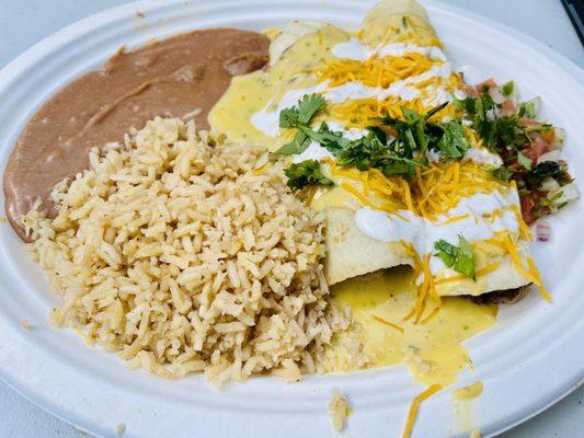 Smoked pulled pork enchiladas with rice and beans