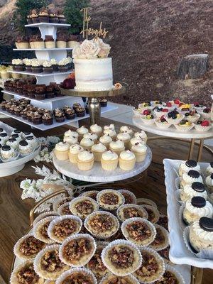 Assorted mini cupcakes and tartlets.