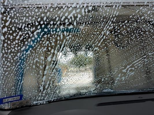 Scrubbed windshield before going into the car wash.