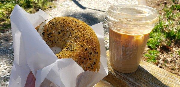 everything bagel with cream cheese and an iced latte