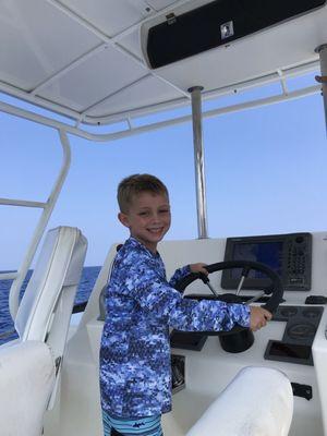 Our grandson at the helm for a picture!