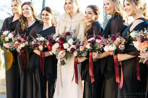 Bride with Her Bridesmaids Holding Their Bouquets