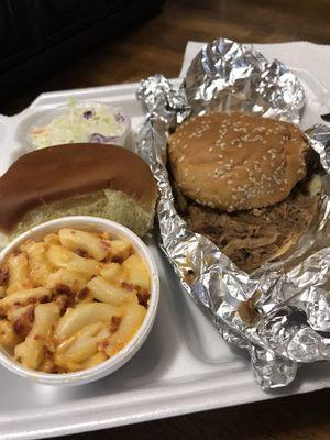 pork sandwich dinner combo with bacon mac & cheese, a dinner roll, and coleslaw. ($7.00)