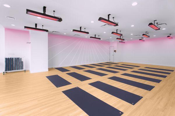 Our yoga room is supercharged with infrared heat which penetrates deep into your body to help detoxify & increase metabolism.