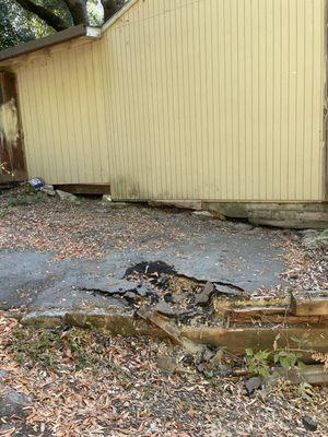 Asphalt and retaining wall damage