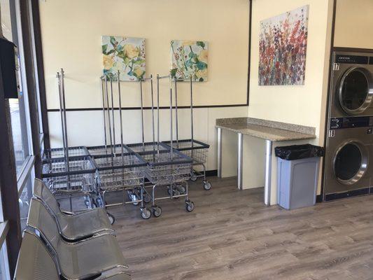 Folding table in addition to more laundry carts for your convenience